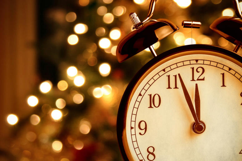 Vintage alarm clock is showing midnight Vintage alarm clock is showing midnight