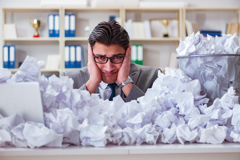 The businessman in paper recycling concept in office The businessman in paper recycling concept in office