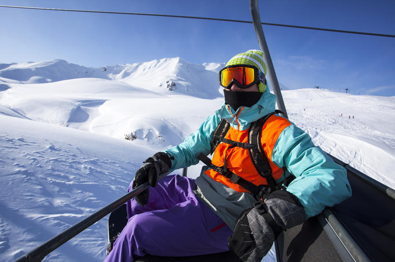 chairlift snowboarder chairlift snowboarder
