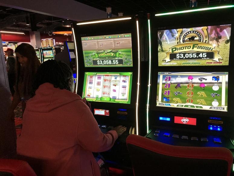 A woman plays "slots" at Rosie's Gaming Emporium in New Kent on April 23, 2019. (Matt Demlein, WRVA)