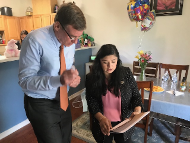 Senator Mark Warner meets with Patricia Santos at her home on Fort Lee on April 25, 2019. (Wayne Covil, WTVR, pool)