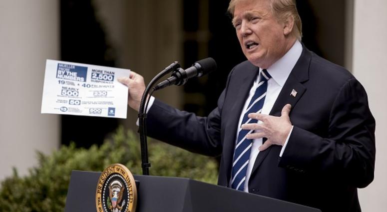 President Donald Trump holds up a stat sheet having to do with the Mueller Report as he speaks in the Rose Garden at the White House in Washington, Wednesday, May 22, 2019.(AP Photo/Andrew Harnik) President Donald Trump holds up a stat sheet having to do with the Mueller Report as he speaks in the Rose Garden at the White House in Washington, Wednesday, May 22, 2019.(AP Photo/Andrew Harnik)