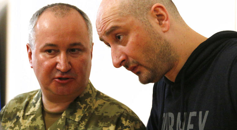 Russian journalist Arkady Babchenko, right, listens to Vasily Gritsak, head of the Ukrainian Security Service during a news conference at the Ukrainian Security Service on Wednesday, May 30, 2018. Babchenko turned up at a news conference in the Ukrainian
