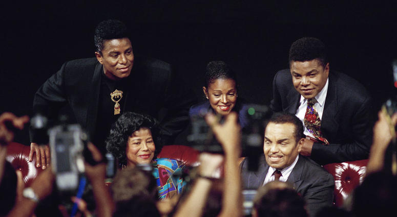 FILE - In this Aug. 30, 1993 file photo, members of the Jackson family, from left, Jermaine Jackson, mother Katherine Jackson, Rebbie Jackson, Joe Jackson, foreground right, and Tito Jackson appear at a press conference in Los Angeles to promote their ben