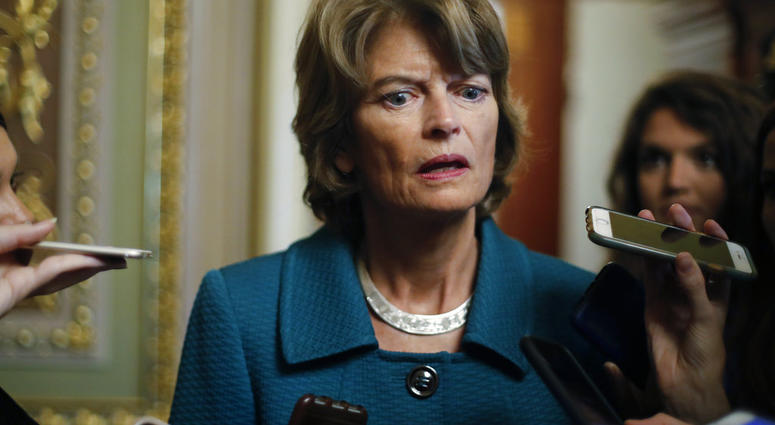Sen. Lisa Murkowski, R-Alaska, speaks to members of the media after a vote to advance Brett Kavanaugh's nomination to the Supreme Court, on Capitol Hill, Friday, Oct. 5, 2018