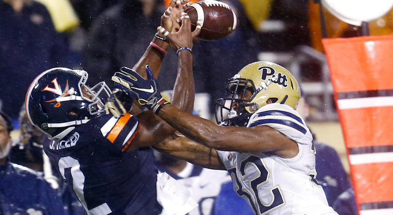 Virginia wide receiver Joe Reed (2) reaches for a pass as Pittsburgh defensive back Phillipie Motley (32) breaks it up during the first half of an NCAA college football game in Charlottesville, Va., Friday, Nov. 2, 2018