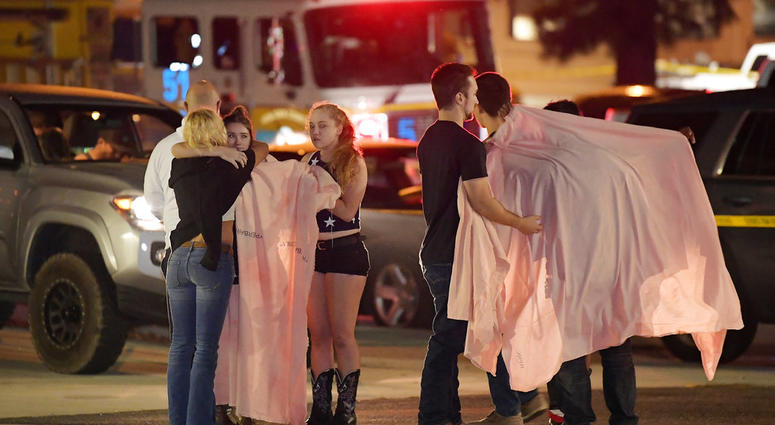 Shooting Survivors comfort each other