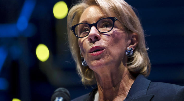 In this Sept. 17, 2018 photo, Education Secretary Betsy DeVos speaks during a student town hall at National Constitution Center in Philadelphia. (AP Photo/Matt Rourke)
