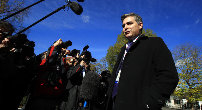 CNN's Jim Acosta speaks to journalists on the North Lawn upon returning back to the White House in Washington, Friday, Nov. 16, 2018. U.S. District Court Judge Timothy Kelly ordered the White House to immediately return Acosta’s credentials.