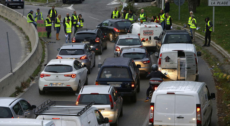 Demonstrators block a motorway exit to protest fuel tax, in Marseille, southern France, Tuesday, Nov. 17, 2018.