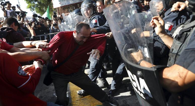 Protesters with Mexican police