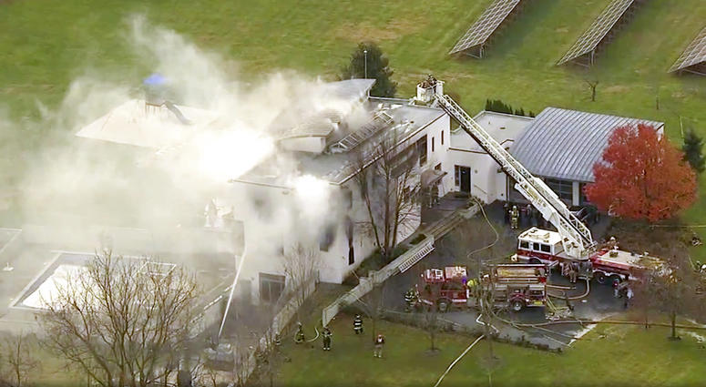 In this image made from a video provided by WABC firefighters battle a fatal fire on Tuesday, Nov. 20, 2018, in Colts Neck, N.J. The Monmouth County prosecutor's office says the fire has taken multiple victims.