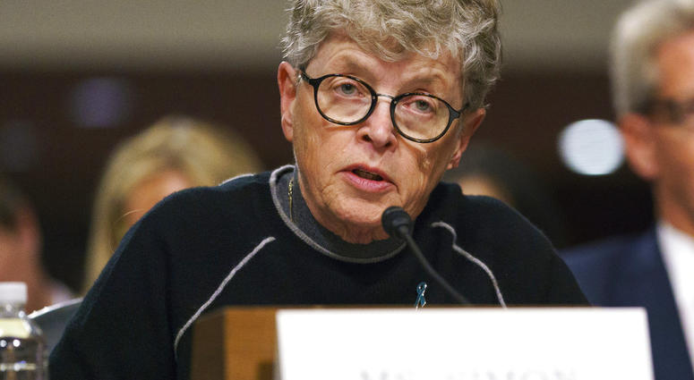In this June 5, 2018 file photo, former Michigan State President Lou Anna Simon testifies before a Senate subcommittee in Washington. Simon has been charged with lying to police