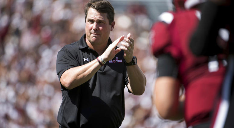 In this Sept. 8, 2018, file photo, South Carolina head coach Will Muschamp watches players before an NCAA college football game against Georgia, in Columbia, S.C. South Carolina