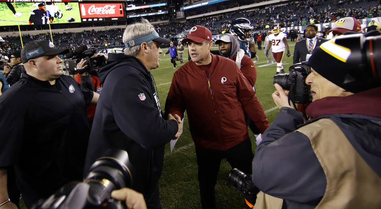 Philadelphia Eagles' Doug Pederson, left, and Washington Redskins' Jay Gruden meet after an NFL football game, Monday, Dec. 3, 2018, in Philadelphia. Philadelphia won 28-13.