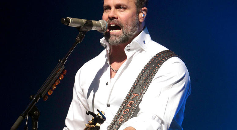 In this Jan. 17, 2013 file photo, Troy Gentry of the Country Music duo Montgomery Gentry performs on the Rebels On The Run Tour in Lancaster, Pa.