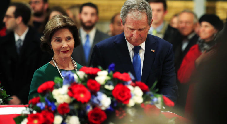 Laura & George W Bush with George H.W. Bush casket