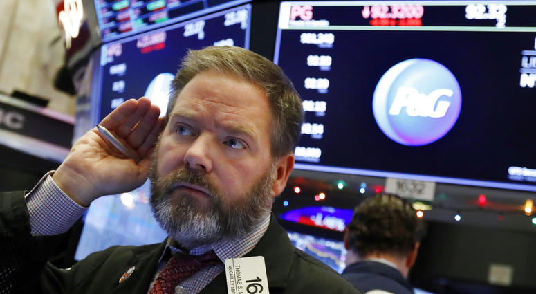 Trader Thomas McCauley works on the floor of the New York Stock Exchange, Thursday, Dec. 6, 2018. (AP Photo/Richard Drew)