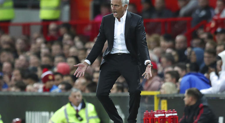 In this Friday, Aug. 10, 2018 file photo Manchester United's manager Jose Mourinho reacts in frustration during the English Premier League soccer match between Manchester United and Leicester City at Old Trafford, in Manchester, England.
