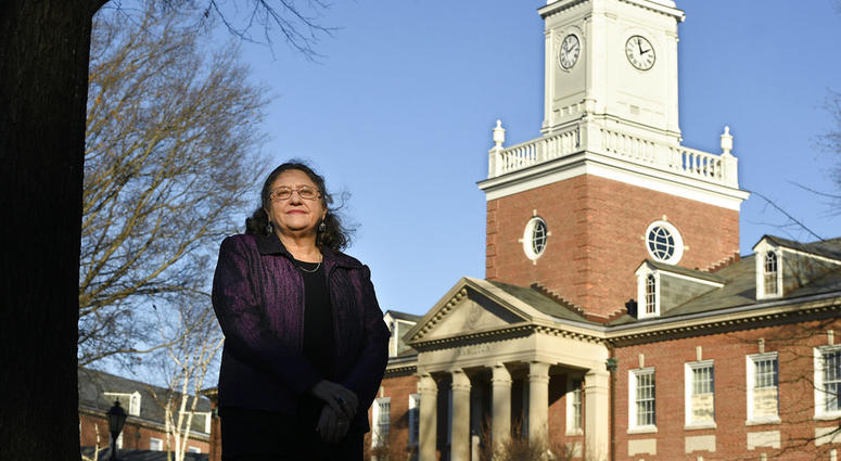 In this Tuesday, Dec. 18, 2018 photo, Michele Fitzpatrick, a retired lieutenant commander in the Coast Guard, poses for a photograph at the United States Coast Guard Academy in New London, Conn.