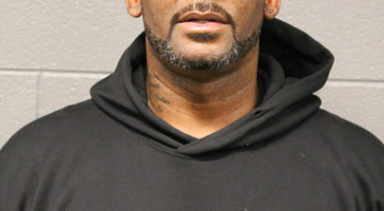 In this photo taken and released by the Chicago Police Dept., Friday, Feb. 22, 2019, R&B singer R. Kelly is photographed during booking at a police station in Chicago, Il. (Chicago Police Dept. via AP)
