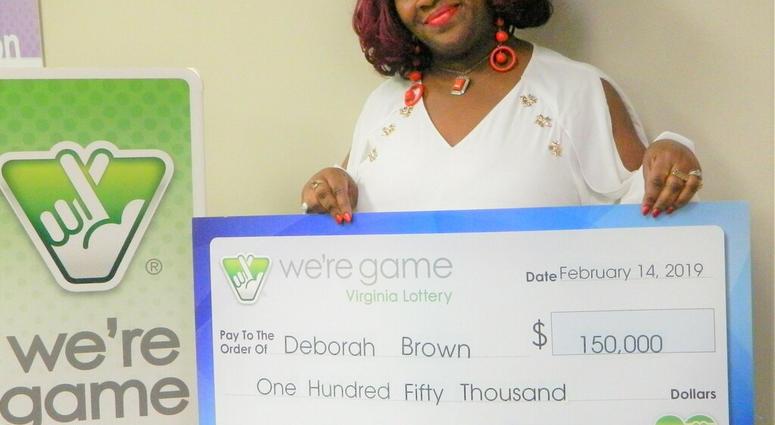 This Feb. 14, 2019 photo provided by Virginia Lottery shows Debrorah Brown holding up a check after winning the Pick 4 in Richmond, Va. (Virginia Lottery via AP) This Feb. 14, 2019 photo provided by Virginia Lottery shows Debrorah Brown holding up a check after winning the Pick 4 in Richmond, Va. (Virginia Lottery via AP)