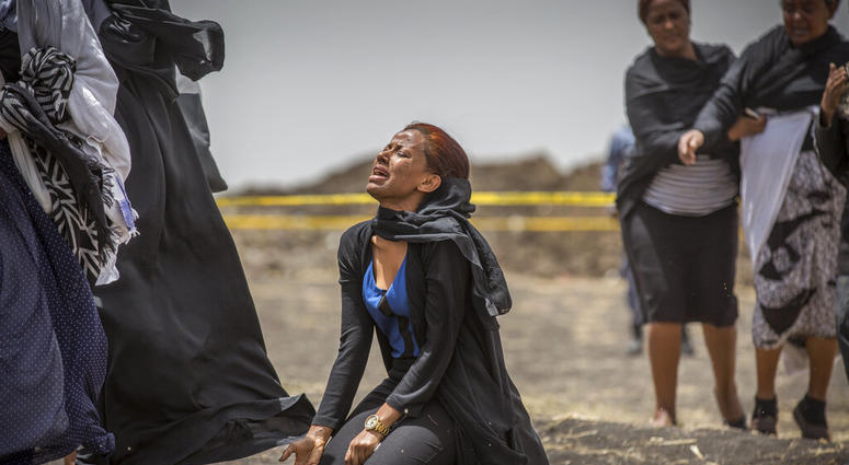 Relative grieving victim at Ethiopia crash site