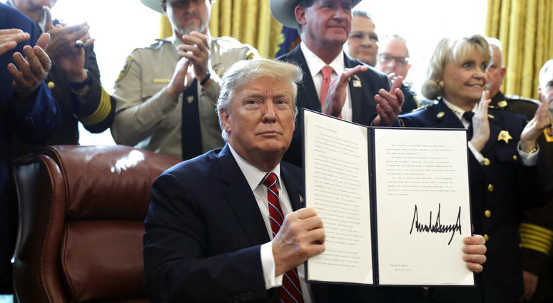 President Donald Trump speaks about border security in the Oval Office of the White House, Friday, March 15, 2019, in Washington. (AP Photo/Evan Vucci)