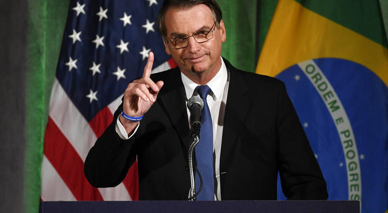 Brazilian President Jair Bolsonaro speaks at the Chamber of Commerce in Washington, Monday, March 18, 2019. (AP Photo/Susan Walsh) Brazilian President Jair Bolsonaro speaks at the Chamber of Commerce in Washington, Monday, March 18, 2019. (AP Photo/Susan Walsh)
