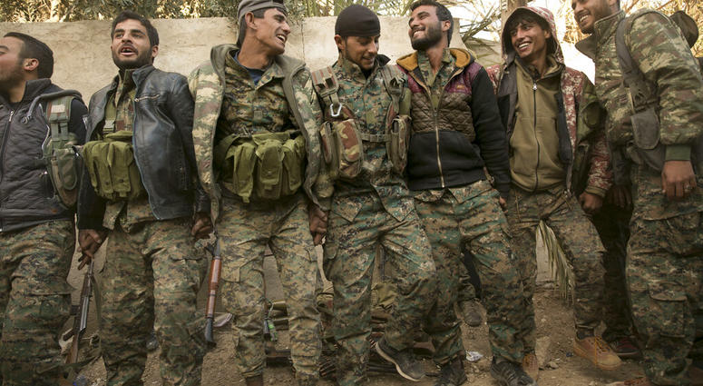 U.S.-backed Syrian Democratic Forces (SDF) fighters celebrate their territorial gains over Islamic State militants in Baghouz, Syria, move to a camp Tuesday, March 19, 2019. (AP Photo/Maya Alleruzzo) U.S.-backed Syrian Democratic Forces (SDF) fighters celebrate their territorial gains over Islamic State militants in Baghouz, Syria, move to a camp Tuesday, March 19, 2019. (AP Photo/Maya Alleruzzo)