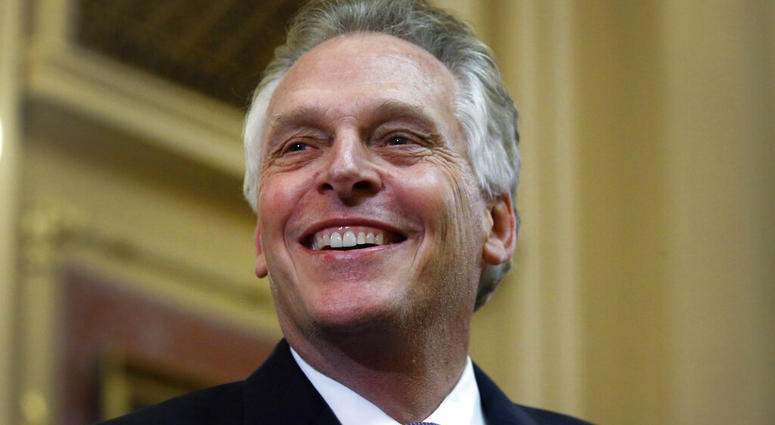 FILE - In this Jan. 10, 2018 file photo, Virginia Gov. Terry McAuliffe delivers his final "State of the Commonwealth" address to the General Assembly at the Capitol in Richmond, Va. (Bob Brown/Richmond Times-Dispatch via AP) FILE - In this Jan. 10, 2018 file photo, Virginia Gov. Terry McAuliffe delivers his final "State of the Commonwealth" address to the General Assembly at the Capitol in Richmond, Va. (Bob Brown/Richmond Times-Dispatch via AP)