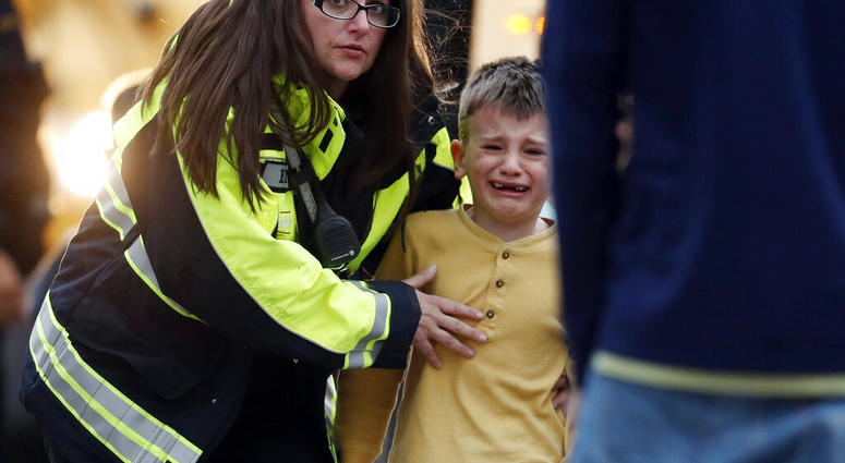 Officials guide students off a bus and into a recreation center where they were reunited with their parents after a shooting at a suburban Denver middle school Tuesday, May 7, 2019, in Highlands Ranch, Colo. (AP Photo/David Zalubowski) Officials guide students off a bus and into a recreation center where they were reunited with their parents after a shooting at a suburban Denver middle school Tuesday, May 7, 2019, in Highlands Ranch, Colo. (AP Photo/David Zalubowski)