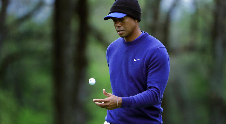 Tiger Woods flips his ball as he walks along the ninth green during a practice round for the PGA Championship golf tournament, Monday, May 13, 2019, in Farmingdale, N.Y. (AP Photo/Julie Jacobson) Tiger Woods flips his ball as he walks along the ninth green during a practice round for the PGA Championship golf tournament, Monday, May 13, 2019, in Farmingdale, N.Y. (AP Photo/Julie Jacobson)