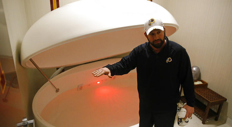 Washington Redskins head athletic trainer Larry Hess demonstrates a salt water float orb inside a recovery room at the team's NFL football training facility in Ashburn, Va. (AP Photo/Patrick Semansky) Washington Redskins head athletic trainer Larry Hess demonstrates a salt water float orb inside a recovery room at the team's NFL football training facility in Ashburn, Va. (AP Photo/Patrick Semansky)