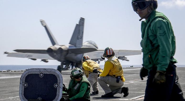 In this Monday, May 20, 2019 photo, released by U.S. Navy, an F/A-18E Super Hornet from the "Jolly Rogers" of Strike Fighter Squadron. (Mass Communication Specialist 3rd Class Jeff Sherman/U.S. Navy via AP) In this Monday, May 20, 2019 photo, released by U.S. Navy, an F/A-18E Super Hornet from the "Jolly Rogers" of Strike Fighter Squadron. (Mass Communication Specialist 3rd Class Jeff Sherman/U.S. Navy via AP)