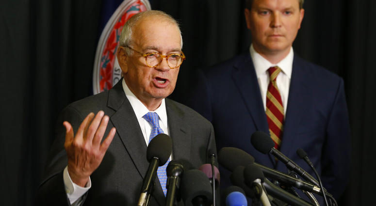 McGuire Woods law firm partner, Richard Cullen, left, gestures as Ben Hatch, right, listen during a news conference in Norfolk, Va., Wednesday, May 22, 2019. (AP Photo/Steve Helber)