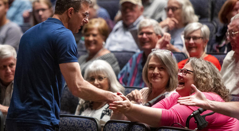 U.S. Rep. Justin Amash, R-Cascade Township, greets the crowd before holding a town hall meeting at Grand Rapids Christian High School's DeVos Center for Arts and Worship on Tuesday, May 28, 2019. (Cory Morse/The Grand Rapids Press via AP)