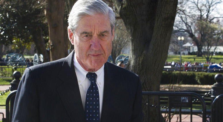 In this March 24, 2019 photo, Special Counsel Robert Mueller walks past the White House, after attending St. John's Episcopal Church for morning services, in Washington. (AP Photo/Cliff Owen, File)