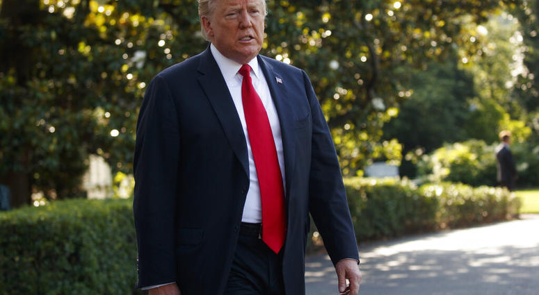In this Thursday, May 30, 2019, file photo, President Donald Trump talks with reporters before departing on Marine One, in Washington. (AP Photo/Evan Vucci, File)