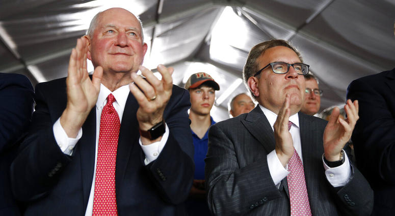 Agriculture Secretary Sonny Perdue, left, and Environmental Protection Agency Administrator Andrew Wheeler applaud as they listen to President Donald Trump speak. (AP Photo/Patrick Semansky) Agriculture Secretary Sonny Perdue, left, and Environmental Protection Agency Administrator Andrew Wheeler applaud as they listen to President Donald Trump speak. (AP Photo/Patrick Semansky)
