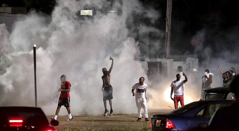 Frayser community residents taunt authorities as protesters take to the streets in anger against the shooting of a youth identified by family members as Brandon Webber by U.S. Marshals on June 12, 2019, in Memphis, Tenn. (Jim Weber/Daily Memphian via AP)