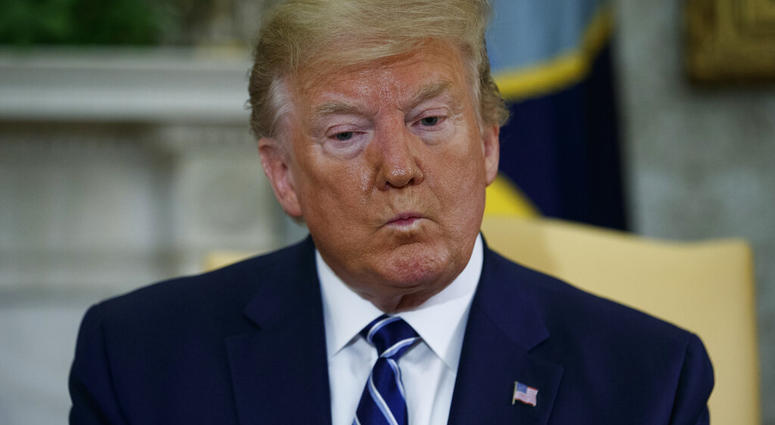 President Donald Trump listens to a question during a meeting with Canadian Prime Minister Justin Trudeau in the Oval Office of the White House, Thursday, June 20, 2019, in Washington. (AP Photo/Evan Vucci)