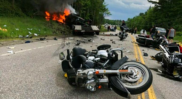 This photo provided by Miranda Thompson shows the scene where several motorcycles and a pickup truck collided on a rural, two-lane highway Friday, June 21, 2019 in Randolph, N.H. New Hampshire State Police said a 2016 Dodge 2500 pickup truck collided with