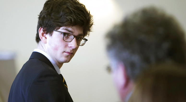 FILE - In this Feb. 21, 2017, file photo, Owen Labrie looks at his family during a break on the first day of a hearing in Concord, N.H., on whether he deserves a new trial. Labrie, a New Hampshire prep school graduate convicted of sexually assaulting a 15
