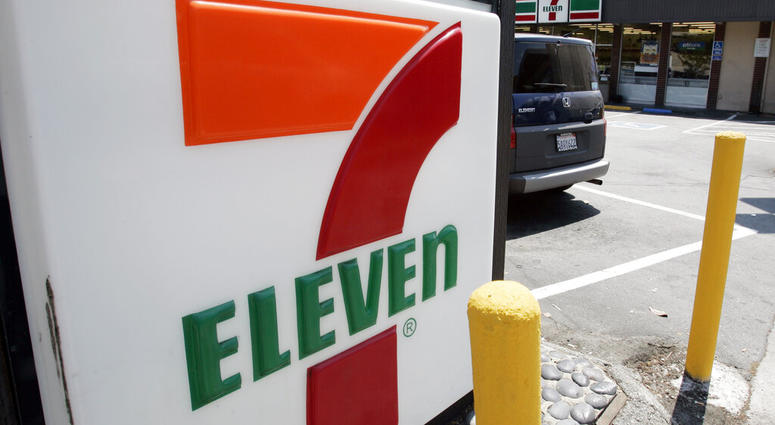 FILE - In this July 1, 2008 file photo, a 7-Eleven is shown in Palo Alto, Calif. The convenience-store chain is launching a service that lets customers order everything from its trademark frozen drink to a battery charger and have it delivered to a public