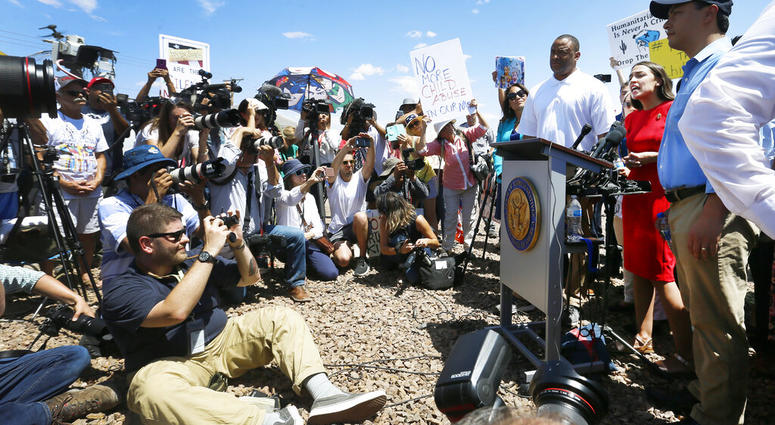 U.S. Rep. Alexandria Ocasio-Cortez, D-New York, talks about what she saw on her tour of area border facilities Monday, July 1, at the Border Patrol station in Clint. Ocasio-Cortez was attempting to talk over the protesters. (Briana Sanchez / El Paso Times