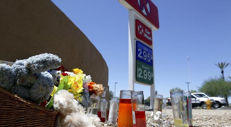 A makeshift memorial for Elijah Al-Amin is set up at a local Circle K store for the death of the stabbing victim Tuesday, July 9, 2019, in Peoria, Ariz. (AP Photo/Ross D. Franklin) A makeshift memorial for Elijah Al-Amin is set up at a local Circle K store for the death of the stabbing victim Tuesday, July 9, 2019, in Peoria, Ariz. (AP Photo/Ross D. Franklin)