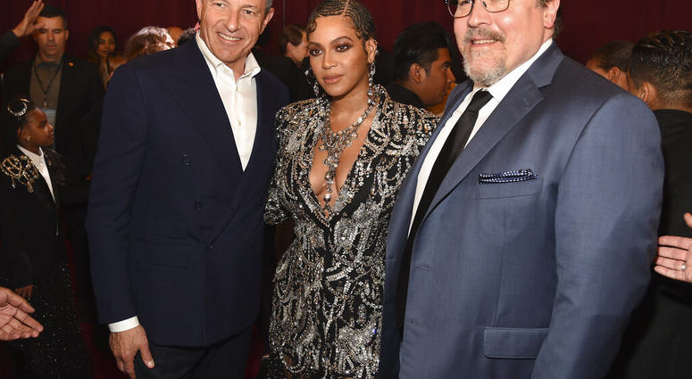 Bob Iger, left, chairman and CEO of The Walt Disney Company, poses with "The Lion King" cast member Beyonce, center, and the film's director Jon Favreau at the premiere of the film. (Photo by Chris Pizzello/Invision/AP) Bob Iger, left, chairman and CEO of The Walt Disney Company, poses with "The Lion King" cast member Beyonce, center, and the film's director Jon Favreau at the premiere of the film. (Photo by Chris Pizzello/Invision/AP)