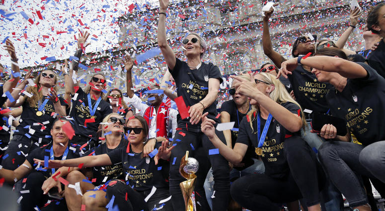 The U.S. women's soccer team, Megan Rapinoe center, celebrates at City Hall after a ticker tape parade, Wednesday, July 10, 2019, in New York. (AP Photo/Seth Wenig) The U.S. women's soccer team, Megan Rapinoe center, celebrates at City Hall after a ticker tape parade, Wednesday, July 10, 2019, in New York. (AP Photo/Seth Wenig)