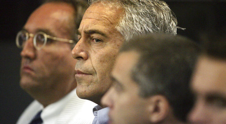 FILE - In this July 30, 2008, file photo, Jeffrey Epstein, center, appears in court in West Palm Beach, Fla. Federal prosecutors, preparing for a bail fight Monday, July 15, 2019, say evidence against Epstein is growing “stronger by the day” after several